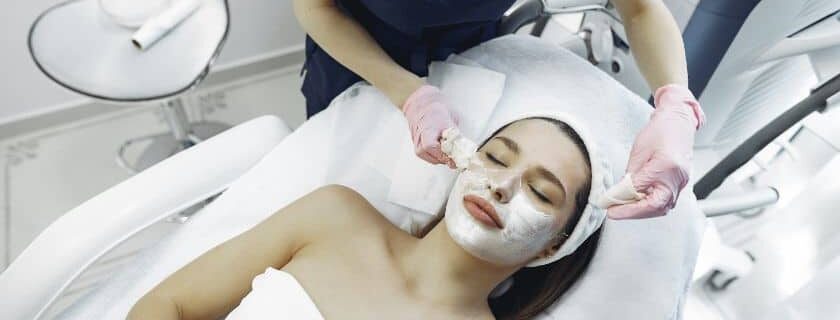 woman in dermatologist clinic undergoing facial procedure